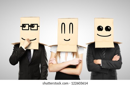 Men And Woman With Smiling Box On Head