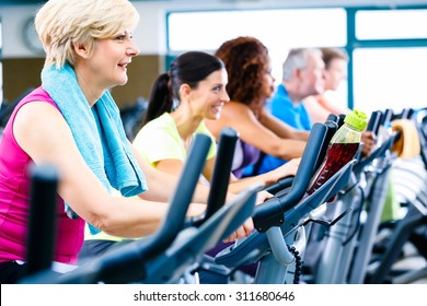 Men And Women Doing Fitness Spinning For Sport, Group Of Young And Senior People