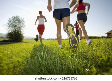 Men and women jogging.