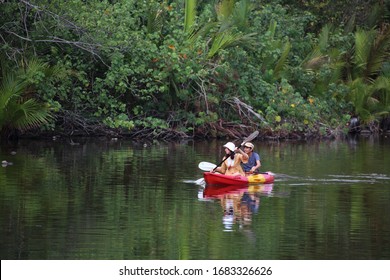 Men and women are kayaking in the canal