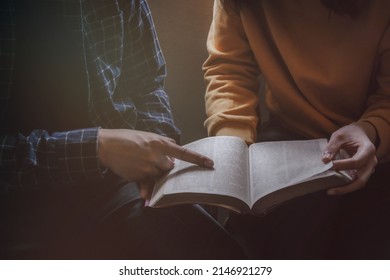 Men And Women Sitting Studying The Bible With Light Shining From Behind . The Concept Of Studying The Bible . Religious School. Sunday