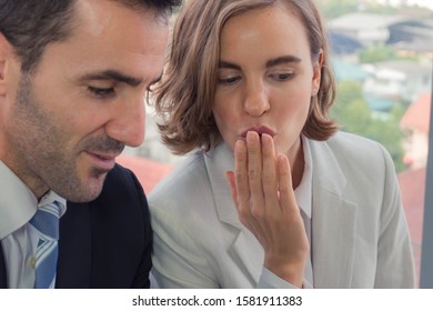 Men And Women Working Together Is A Picture That Focuses On The Face Of A Woman Who Is Shocked Or Excited To See Something Saw A Man With A Blurred Face In His Office