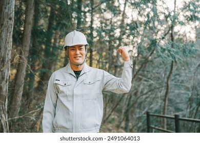 Men in work clothes working in forestry, environmental protection and construction sites