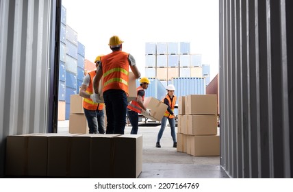 Men worker loading cardboard boxes into containers, Warehousing and logistic shipping cargo concept - Powered by Shutterstock