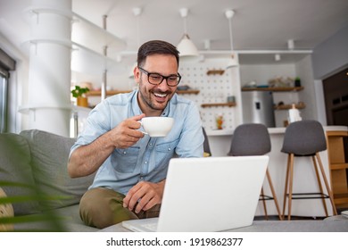 Men Working On Laptop Computer In His Room. Home Work Or Study, Freelance Concept. Young Man Sitting Relaxed On Sofa With Laptop. Modern Businessman Using Laptop