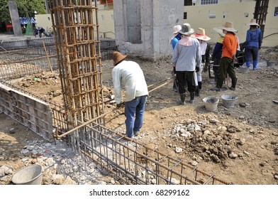 Men working at site construction. Photo Show is a template to place the concrete beam only.