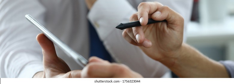 Men in workplace and sign an electronic document. Sign banking documents with an electronic stylus. Simplify procedure for signing documents in electronic form. Modern and convenient tool
