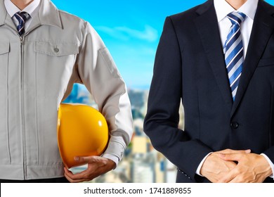 Men In Workwear And Businessmen In Suits