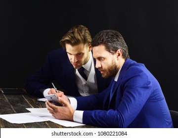 Men With Worried Faces Read Business News. Business Partners In Formal Suits Look At Smartphone. Financial Crisis, Credit Debts, Bunckrucy. Business Meeting, Failure, Bad Luck, Money Concept.