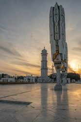 The Menara Masjid Raya Baiturrahman Is A Towering Grandeur, Serving As An Iconic Symbol Of Magnificence And Beauty In The City With Its Graceful Architecture.