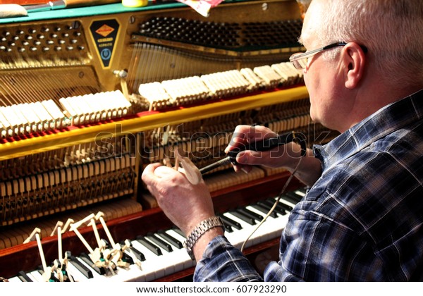  Mending and tuning\
of the old piano