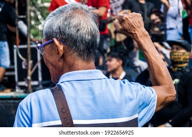 Mendiola, San Miguel, Metro Manila, Philippines. 25th February 2020. An Elderly Man With A Raised Fist In A Protest During The 34th Anniversary Of The EDSA People Power Revolution.