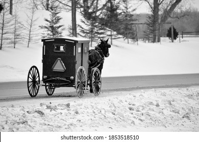 A Mennonite Horse And Buggy Photographed In Rural Ontario On A Snowy Winter Afternoon.