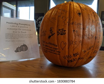 Menomonee Falls, WI / USA - October 9, 2020: A Positivity Pumpkin Sits In Starbucks With Messages Written In Sharpie.