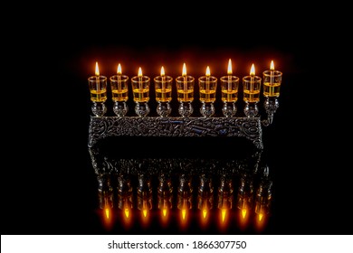 Menorah With Burning Oil Candles With Reflection For Hanukkah Jewish Holiday.