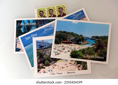 Menorca (Minorca), Spain - July 6 2022: Postcards Of The Most Famous Places Of Menorca And Postage Stamps. Postcards Prepared For Sending. Holiday Postcards