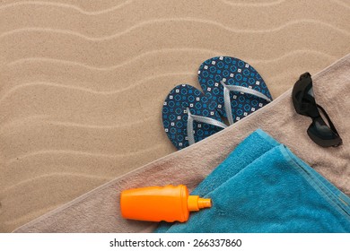 Men's accessories for the beach lying on the sand, with place for your tex - Powered by Shutterstock