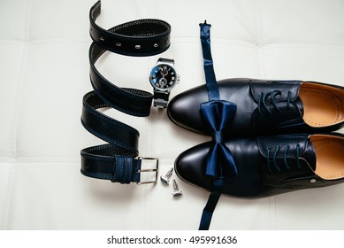 Men's accessories men's shoes, watches, glasses, bow tie, sleeve shirt and strap. Black and white minimalistic composition on a white background. Classic men's accessories. Top view - Powered by Shutterstock