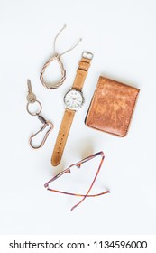 Men's accessories with vintage watch, wallet, bracelet, key and sunglasses on white background - Shutterstock ID 1134596000