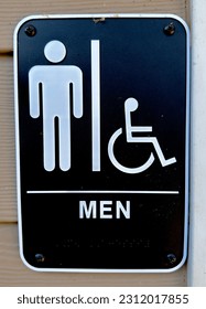 Men's bathroom sign on the wall outside of facility - Shutterstock ID 2312017855