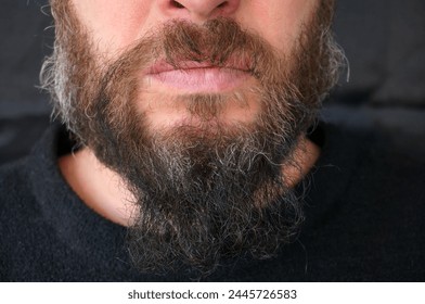 Men's beard. The guy's face is large. Brutal macho. Mustache and beard. Barber. Lumberjack. Portrait of a handsome man with a beard                               
