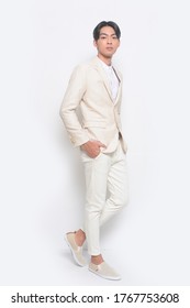 Men's Beauty, Fashion. Handsome Full Body Young Man In Suit With White Khaki Pants And Casual, Shoes  

