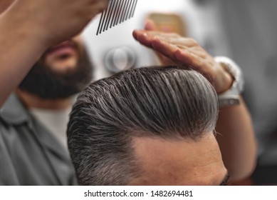 Men's Beauty Salon. The Man Makes A Haircut.