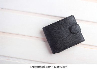 men's black wallet money in cash wooden white vintage background