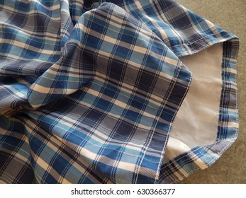 Mens Blue, White, And Gray Check Swimming Shorts - Creased And Crumpled At Different Angles