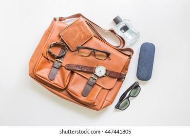 Men's Brown Leather Bag With Accessories, Flat Lay, Top View Background