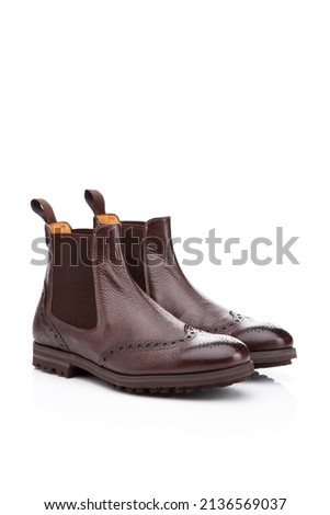 men's brown leather chelsea boots isolated on white background