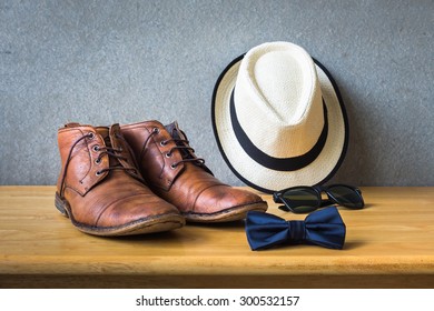 Men's casual, bow tie with sunglasses and shoes on wooden over wall grunge background - Shutterstock ID 300532157