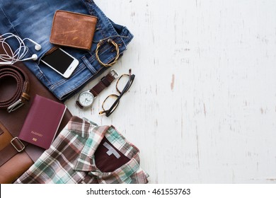 Men's casual outfits with man clothing and accessories on rustic wooden background, travel concept - Powered by Shutterstock