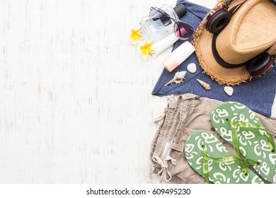 Men's Casual Summer Clothes With Accessories Items On White Rustic Wooden Board Background, Overhead Top View, Flay Lay