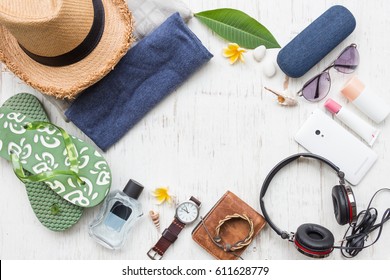 Men's Casual Summer Clothes With Accessories Items On White Rustic Wooden Board Background, Overhead Top View, Flay Lay