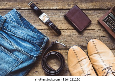 Men's clothes and accessories on wooden background. Top view - Powered by Shutterstock