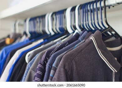 Mens Clothes Hanging In Closet