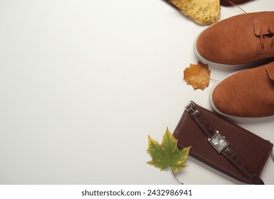 Men's clothes, shoes and accessories on a white background with autumn leaves. Seasonal clothing. Top view. Flat lay. Copy space - Powered by Shutterstock