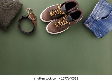 Mens Fall Casual Clothing Outfits And Accessories Flat Lay On Olive Green Background, Top View