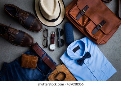 Men's fashion, casual outfits with accessories, flat lay, top view on gray grunge background - Shutterstock ID 459038356