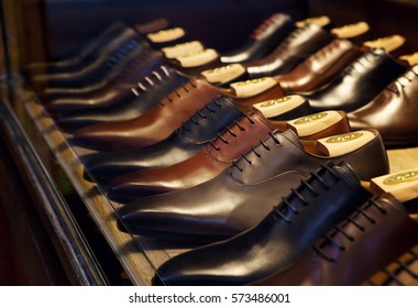 Men's fashion leather shoes on shop window. Concept of diversity, high quality, elegance, honest business relationship