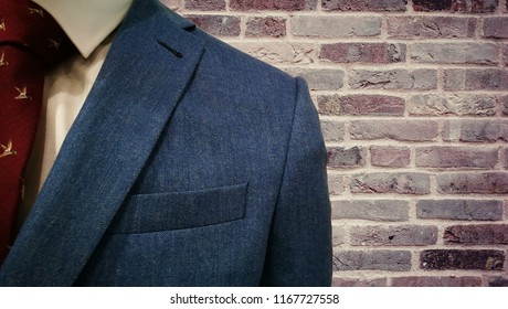 Mens Fashion Suit Isoleated On Brick Wall Background.