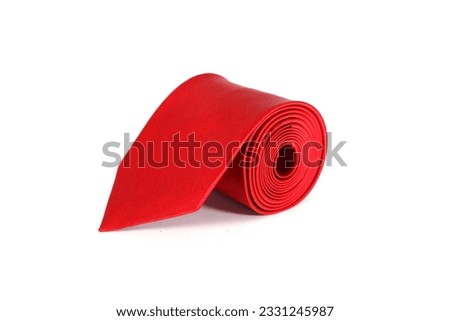 men's fashionable red colour necktie rolled isolated on white background close up shot single object concept nobody 