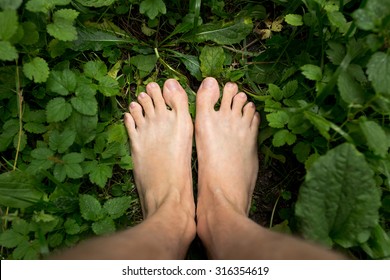 Mens Feet Standing On Grass