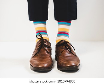 Men's feet in stylish shoes and bright socks - Powered by Shutterstock