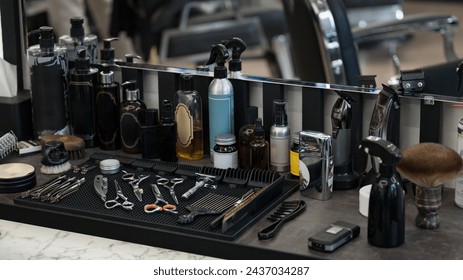 Men's hair and beard care products. Barbers tools for mens haircuts laid out on a table. - Powered by Shutterstock