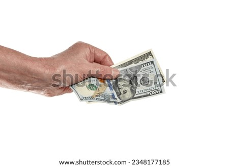 Men's hand holding 100 dollar bill isolated on white background. One hundred dollar bills different years of production in man hand to paying and giving