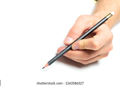 Men's hand holding wooden pencil on isolated backgroung, close up