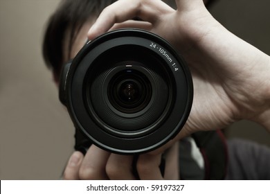 Men's hands held camera closeup - Powered by Shutterstock