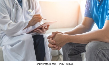 Men's health exam with doctor or psychiatrist working with patient having consultation on diagnostic examination on male disease or mental illness in medical clinic or hospital mental health service 
